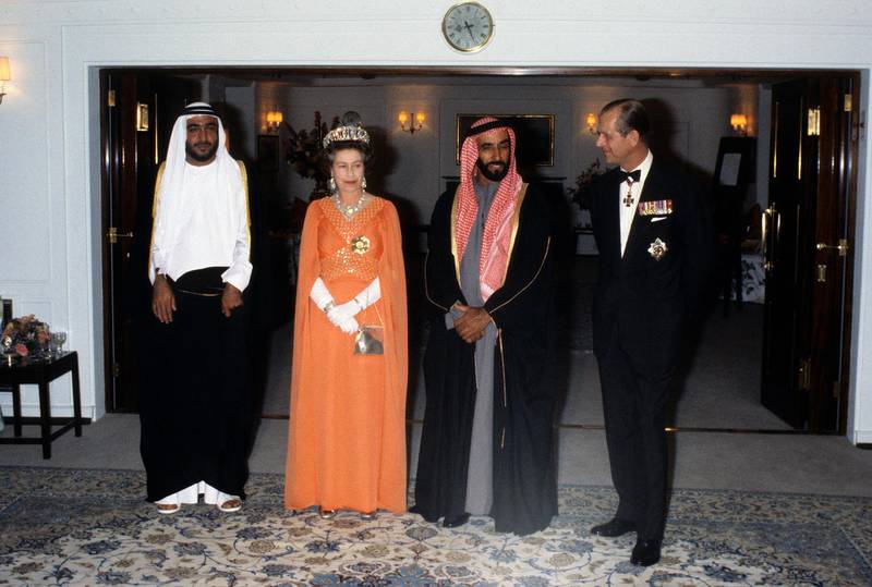 ABU DHABI, UNITED ARAB EMIRATES - FEBRUARY 25:  Queen Elizabeth ll and Prince Philip, Duke of Edinburgh entertain Sheikh Zayed of Abu Dhabi on board the Royal Yacht Britannia during a State Visit to the Gulf States on February 25, 1979 in the United Arab Emirates. (Photo by Anwar Hussein/Getty Images)