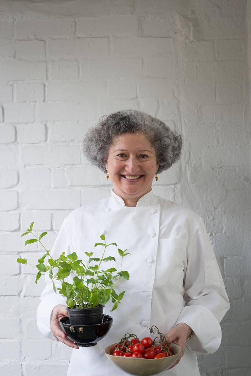 London -- August 23, 2013 -- Anissa Helou, chef, at home in London.  Holding mint and tomatoes. (Eleanor Bentall/The National) *** Local Caption ***  Anissa_Helou_0010.JPG