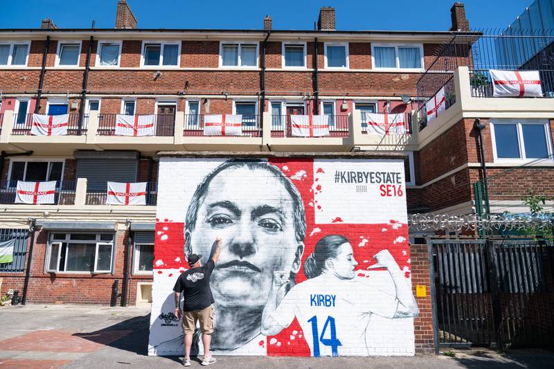 Artist Mr Meana put the finishing touches to a mural of England footballer Fran Kirby, on the Kirby Estate, in Bermondsey, south-east London on Monday, to celebrate the UEFA Women's Euro 2022 tournament, which is under way in England. PA