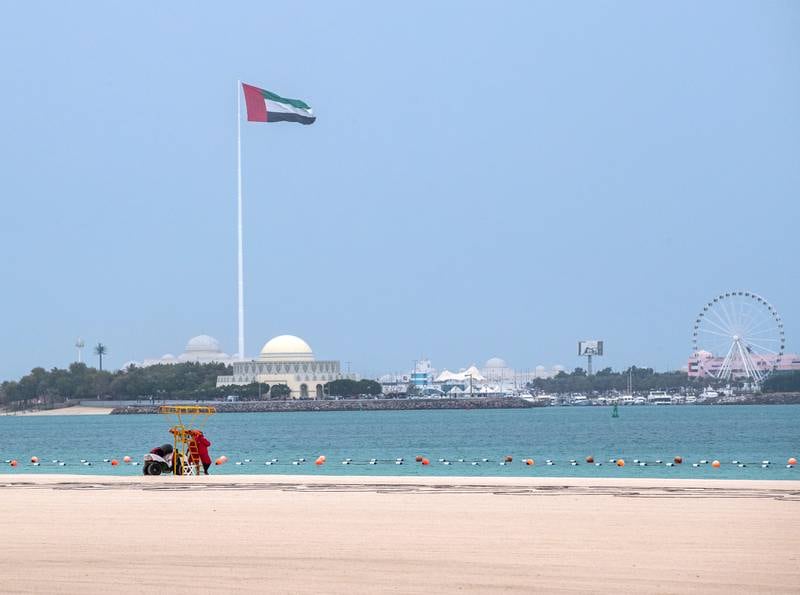 An almost deserted beach in Abu Dhabi during the wet weather. Victor Besa / The National