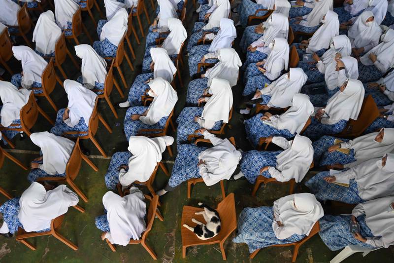 Muslim students at a ceremony during a visit by members of the Nottinghamshire Band of the Royal Engineers to a boarding school in Jakarta to celebrate Queen Elizabeth II's platinum jubilee. AFP