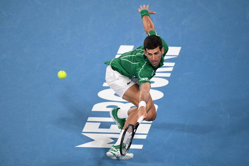 Novak Djokovic hits a return. AFP