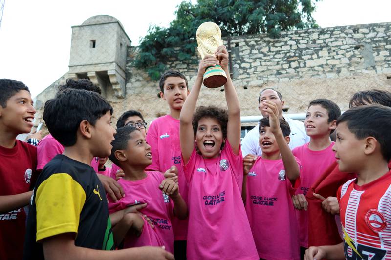 Children celebrate victory in the final match of the 'World Cup in Our Neighbourhood' in Tunisia's capital Tunis. All photos by Reuters