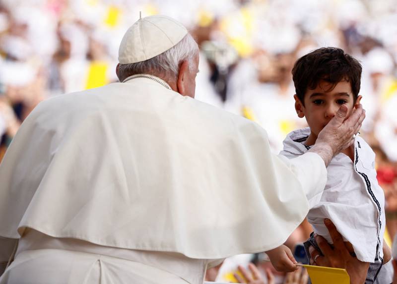 Pope Francis blesses a boy as he attends a holy mass at Bahrain National Stadium during his apostolic journey, in Riffa, Bahrain. Reuters