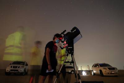 DUBAI, UNITED ARAB EMIRATES , August 13 – 2020 :- People watching the Perseid meteor shower at the Al Qudra desert area in Dubai. The event was organized by Dubai Astronomy Group with all the precaution against Covid 19 such as safe distance between the families and mask was mandatory. The event started on August 12 at 10pm to 2am on August 13.  (Pawan Singh / The National) For News/Standalone/Online/Instagram/Big Picture