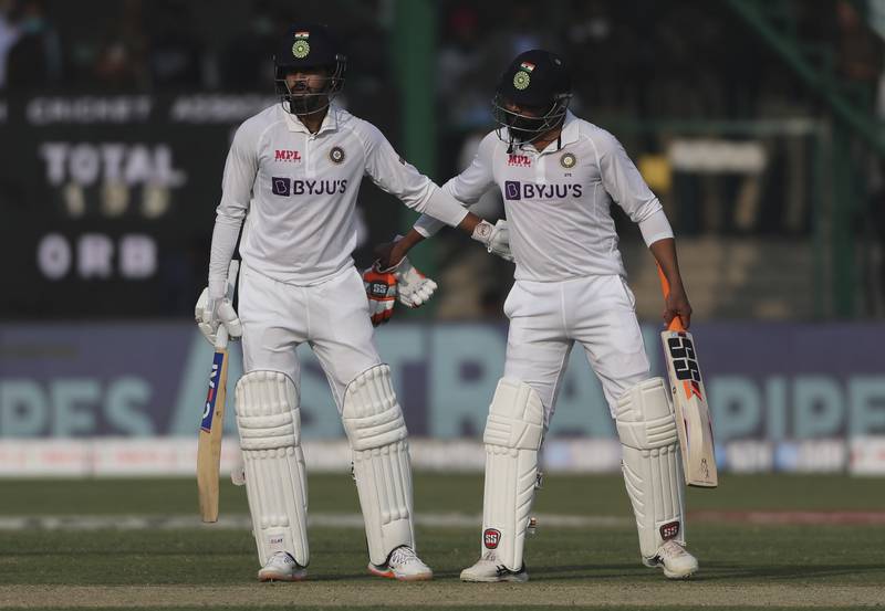 India's Shreyas Iyer is congratulated by his teammate Ravindra Jadeja, right, after reaching his fifty. AP