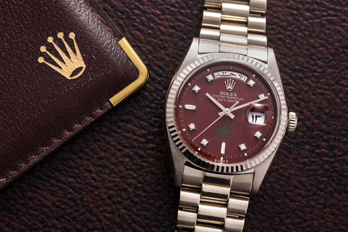 Custom made for the Sultanate of Oman, this white gold and diamond day-date Rolex with oxblood dial sold for $81,250. Christie's