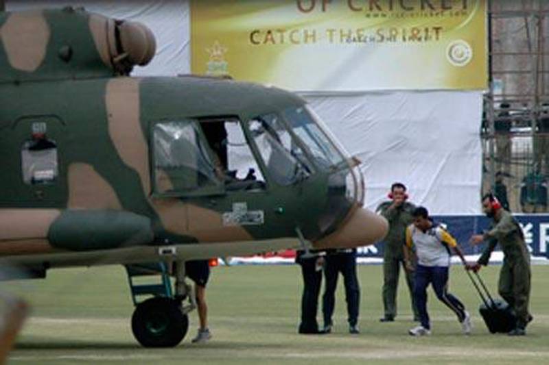 A Sri Lankan player boards the helicopter at Gaddafi stadium after the team bus was attacked in Lahore.