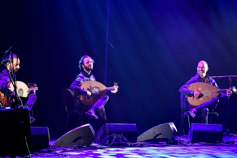 Stage lights complement Le Trio Joubran's performance at Abu Dhabi Cultural Foundation