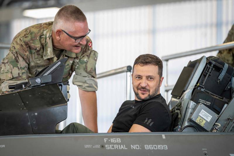 Ukrainian President Volodymyr Zelenskyy sits in a F-16 fighter jet in the hangar of the Skrydstrup Airbase in Vojens, northern Denmark on Sunday. AFP