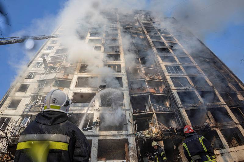 Firefighters work to put out a fire in a residential apartment building after it was hit by shelling in Kyiv, Ukraine. Reuters