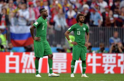 epa06807932 Omar Othman (L) of Saudi Arabia reacts during the FIFA World Cup 2018 group A preliminary round soccer match between Russia and Saudi Arabia in Moscow, Russia, 14 June 2018.

(RESTRICTIONS APPLY: Editorial Use Only, not used in association with any commercial entity - Images must not be used in any form of alert service or push service of any kind including via mobile alert services, downloads to mobile devices or MMS messaging - Images must appear as still images and must not emulate match action video footage - No alteration is made to, and no text or image is superimposed over, any published image which: (a) intentionally obscures or removes a sponsor identification image; or (b) adds or overlays the commercial identification of any third party which is not officially associated with the FIFA World Cup)  EPA/PETER POWELL   EDITORIAL USE ONLY