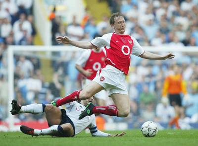 LONDON - APRIL 25:  Ray Parlour of Arsenal is challenged by Jamie Redknapp of Tottenham during the FA Barclaycard Premiership match between Tottenham Hotspur and Arsenal at White Hart Lane on April 25, 2004 in London.  (Photo by Shaun Botterill/Getty Images)
