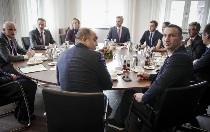 Wladimir Klitschko attends a meeting with German Finance Minister Christian Lindner, back, second left, in Berlin. AP
