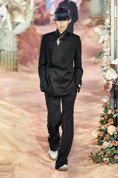 With jewellery at the throat and flared trousers, Dior updates the classic suit. Courtesy Dior