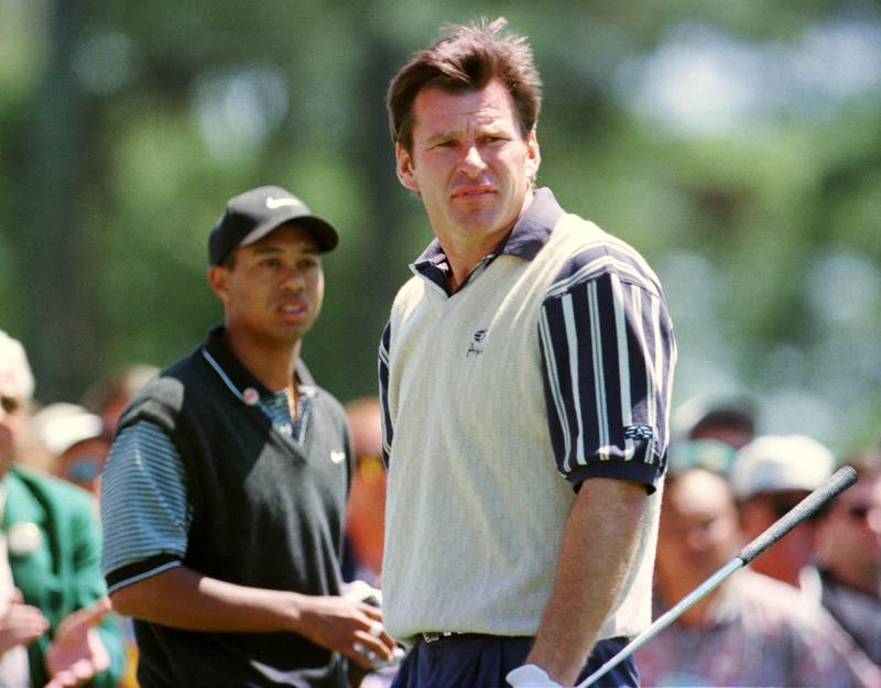 Nick Faldo and Tiger Woods wait to tee off on the first hole of the opening round of the 1997 Masters. Reuters