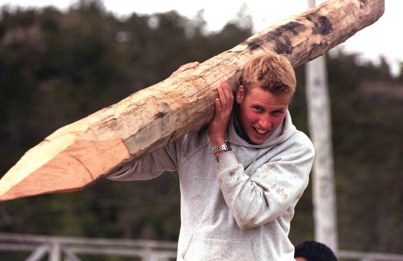 2000: Prince William carries a log used to construct walkways to link buildings during his Raleigh International expedition in the village of Tortel, Southern Chile. Getty Images