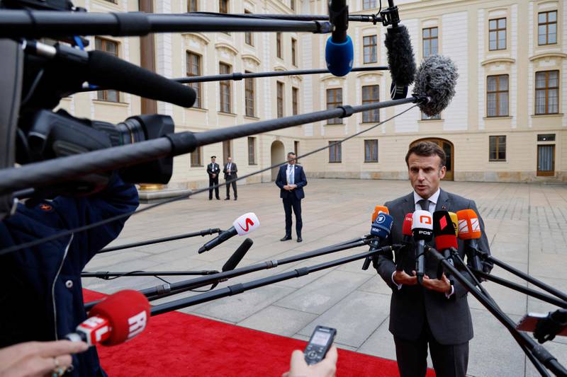 French President Emmanuel Macron speaks to media as he arrives at Prague Castle. AFP