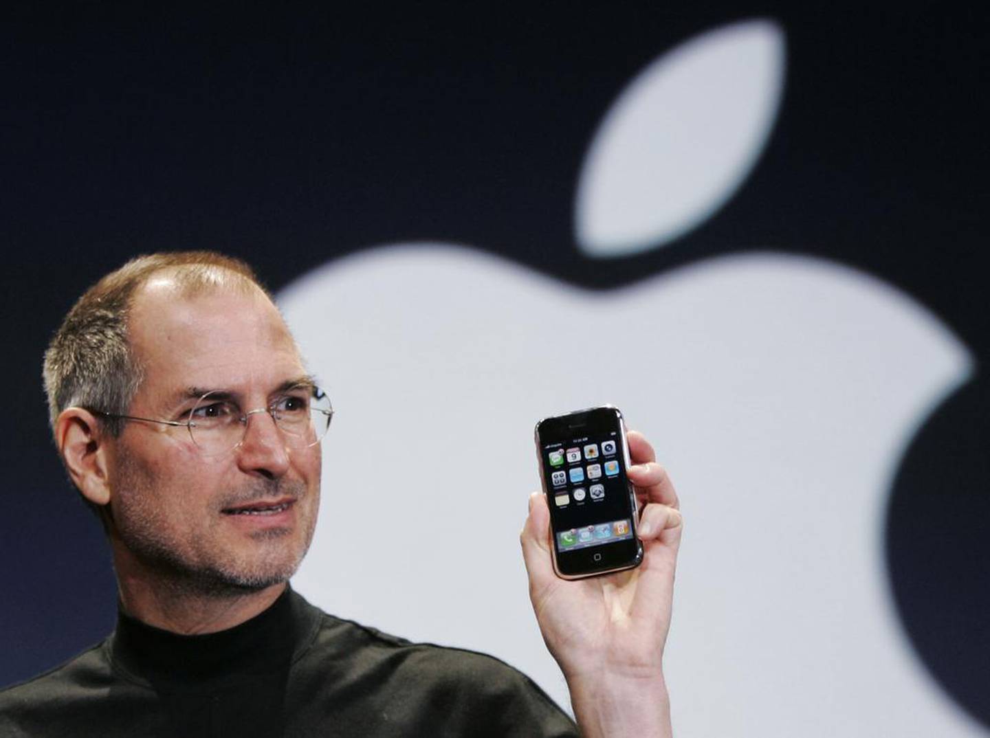 Steve Jobs with the original Apple iPhone at the MacWorld conference in San Francisco on January 9, 2007. AP