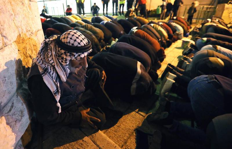 Palestinian Muslim worshippers gather for an early morning prayer service around the Ibrahimi Mosque or the Tomb of the Patriarch in Hebron, West Bank.  EPA