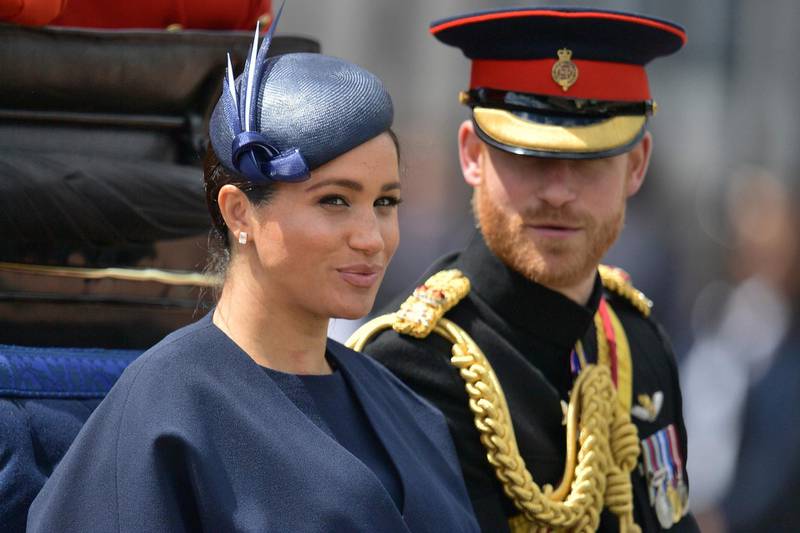(FILES) In this file photo taken on June 08, 2019 Britain's Meghan, Duchess of Sussex (L) and Britain's Prince Harry, Duke of Sussex (R) return to Buckingham Palace after the Queen's Birthday Parade, 'Trooping the Colour', in London.

 Britain's Prince Harry and his wife Meghan will give up their titles and stop receiving public funds following their decision to give up front-line royal duties, Buckingham Palace said on January 18, 2020. "The Sussexes will not use their HRH titles as they are no longer working members of the Royal Family," the Palace said, adding that the couple have agreed to repay some past expenses. / AFP / Daniel LEAL-OLIVAS
