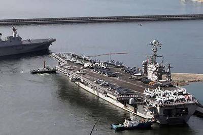 The USS George Washington, a 97,000-ton aircraft carrier from the US 7th fleet, leaves the South Korean naval base in Busan, on the east coast of South Korea.