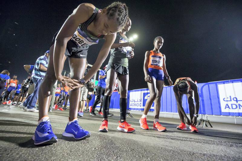 ABU DHABI, UNITED ARAB EMIRATES- Elite runners warming up before the race at the ADNOC ABU Abu Dhabi Marathon.  Leslie Pableo for The National 