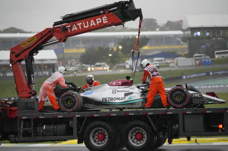 The car of Mercedes driver George Russell is placed on a tow truck after he crashed during a qualifying session. AP