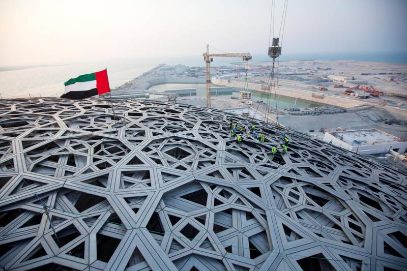 Abu Dhabi, United Arab Emirates, September 17, 2015:     The last piece of the roof is put into place at the Louvre construction site on Saadiyat Island in Abu Dhabi on September 17, 2015. Christopher Pike / The NationalReporter: Nick LeechSection: Louvre *** Local Caption ***  CP0917-Louvre24.JPGNa28se-Louvre1.JPG Na28se-Louvre1.JPG