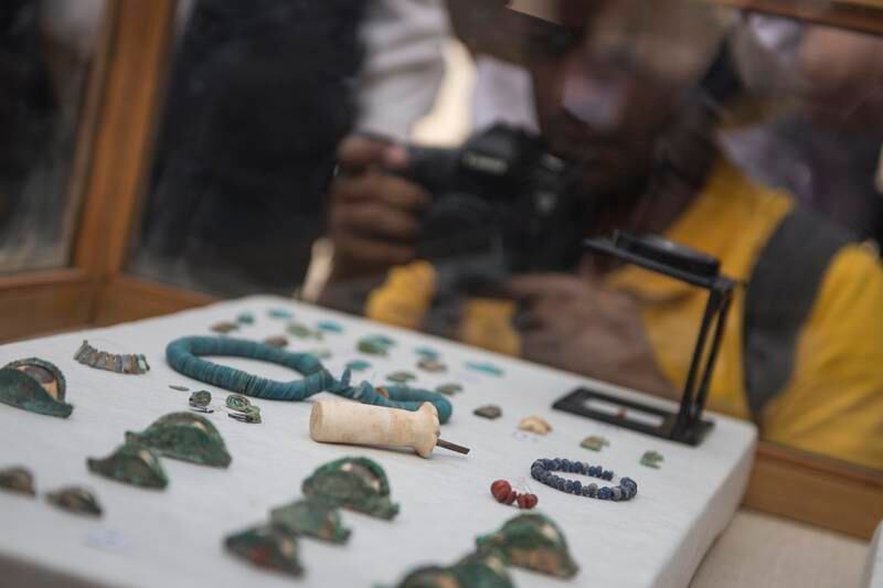 Tools, jewellery and stones found in the tomb. EPA