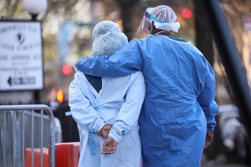 Medical workers walk during a short break at Maimonides Medical Center in the Brooklyn borough of New York, USA. Reuters
