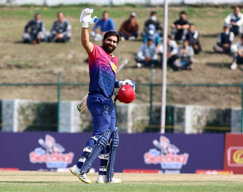 UAE captain Muhammad Waseem celebrates after reaching his century in the Cricket World Cup League 2 match against Papua New Guinea at the TU International Cricket Stadium in Kathmandu on Wednesday, March 15, 2023. All images Subas Humagain for The National