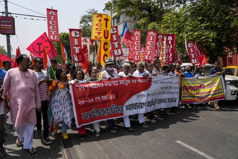 Supporters of the Left Front, Indian National Congress and various trade unions march in Kolkata in support of the two-day strike. Their banner in reads, 'Save the country, save the people of the country, support the all-India strike'. AP Photo