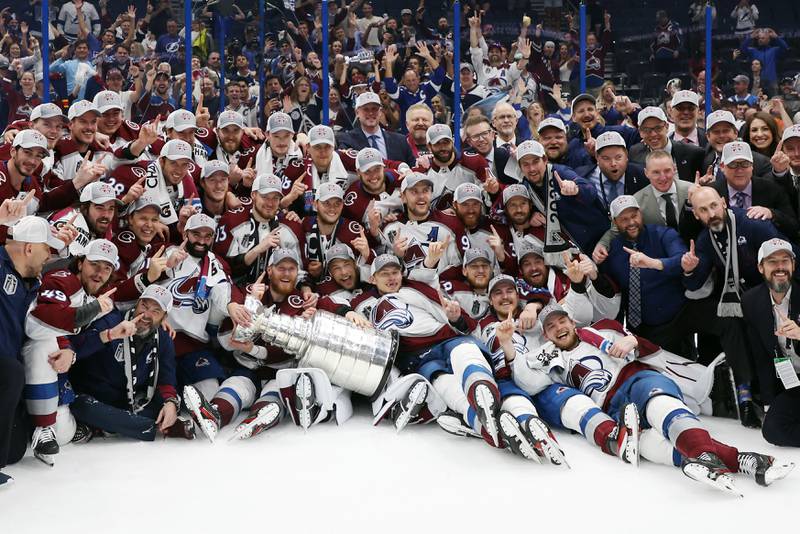 Colorado Avalanche coaches and players pose for a photo after defeating the Tampa Bay Lightning 2-1 in Game Six of the 2022 NHL Stanley Cup Final. AFP
