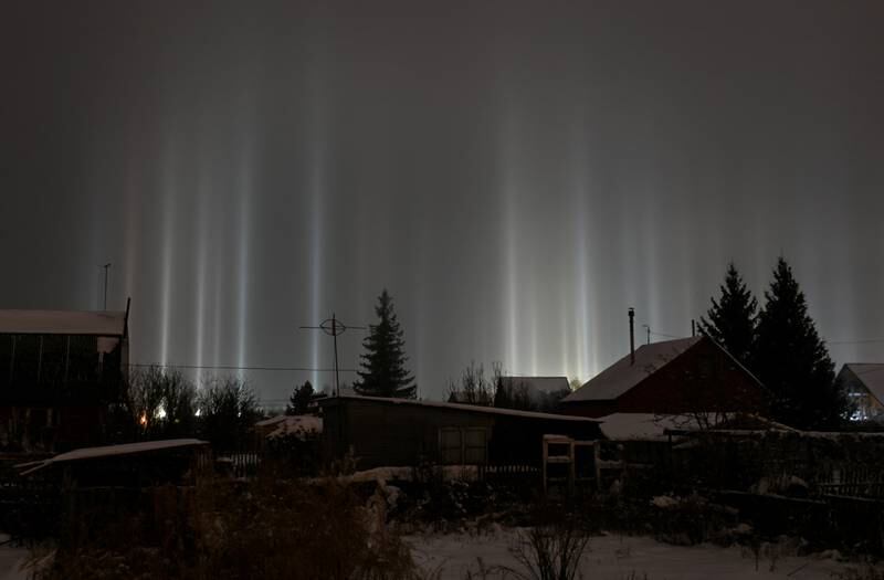 Pillars of light pierce the night sky in Omsk, Russia. Reuters