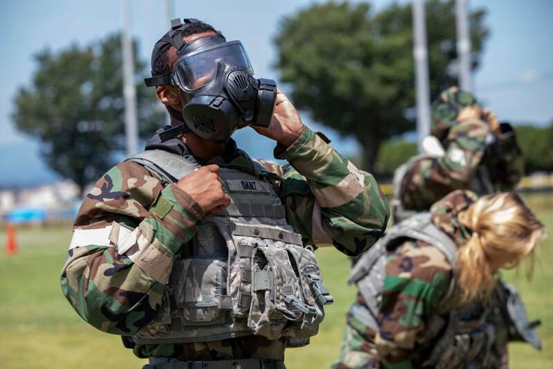 Senior Airman Antonio Gant dons mission-oriented protective posture (MOPP) gear during training at Yokota Air Base, Japan. Photo: US Air Force
