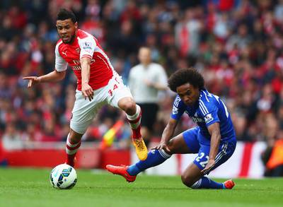 Arsenal's Francis Coquelin challenges Chelsea's Willian on Sunday during their scoreless draw in the Premier League. Paul Gilham / Getty Images