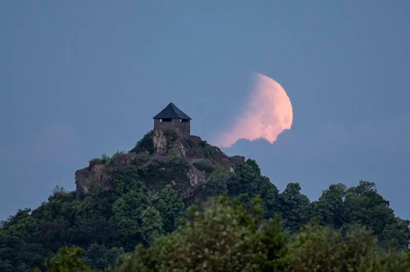 The Moon during an eclipse above Salgo Castle in Salgotarjan, Hungary. EPA