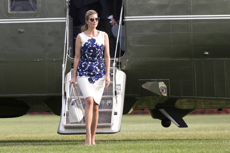 Ivanka Trump, wearing a white shift dress with a blue lace pattern, walks on the White House grounds in Washington on August 30, 2017. EPA