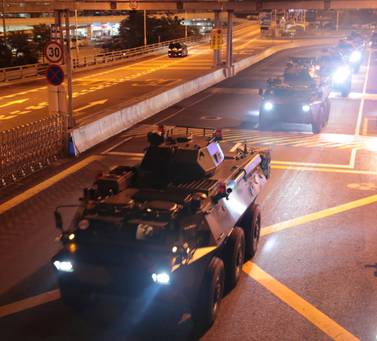 Chinese troops enter Hong Kong on August 29, 2019 during an annual rotation of te territory's garrison. Xinhua via Reuters