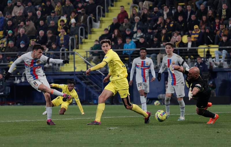 Pedri takes a shot on goal against Villarreal goalkeeper Pepe Reina. EPA