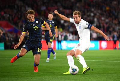 SOUTHAMPTON, ENGLAND - SEPTEMBER 10: Harry Kane of England scores his sides second goal as he is closed down by Mergim Vojvoda of Bulgaria during the UEFA Euro 2020 qualifier match between England and Kosovo at St. Mary's Stadium on September 10, 2019 in Southampton, England. (Photo by Clive Mason/Getty Images)