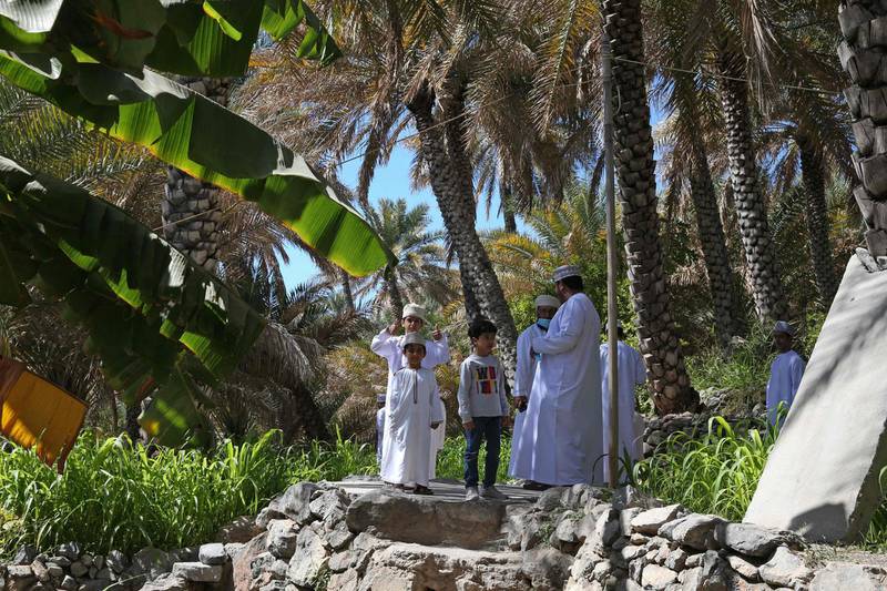 Omanis gather in the village of Misfat Al Abriyeen, which became popular among visitors seeking adventure. AFP