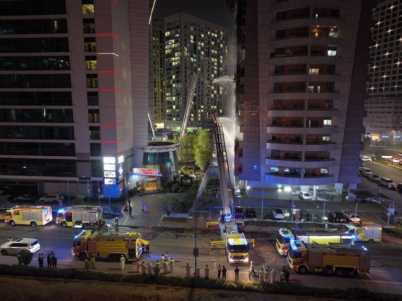Fire crews tackle a blaze at a building in the Barsha Heights district of Dubai. Photo: Dubai Civil Defence