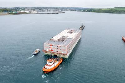 The Bibby Stockholm barge, which is due to accommodate migrants in the UK, arrives in Falmouth, Cornwall. PA