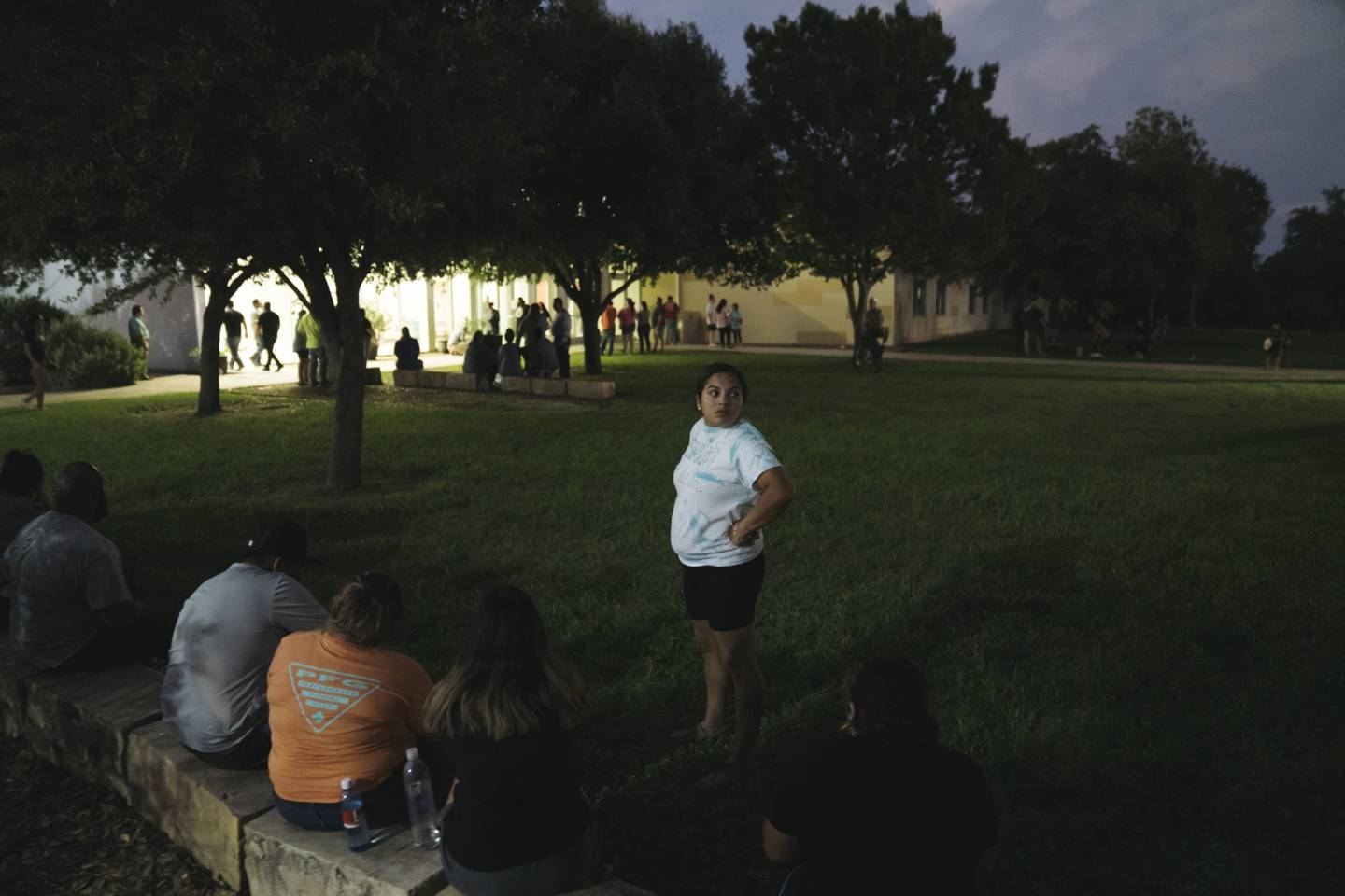 People gather outside a civic centre in Uvalde, Texas, on Tuesday as they wait for news on the fate of children still unaccounted for after the shooting. Bloomberg