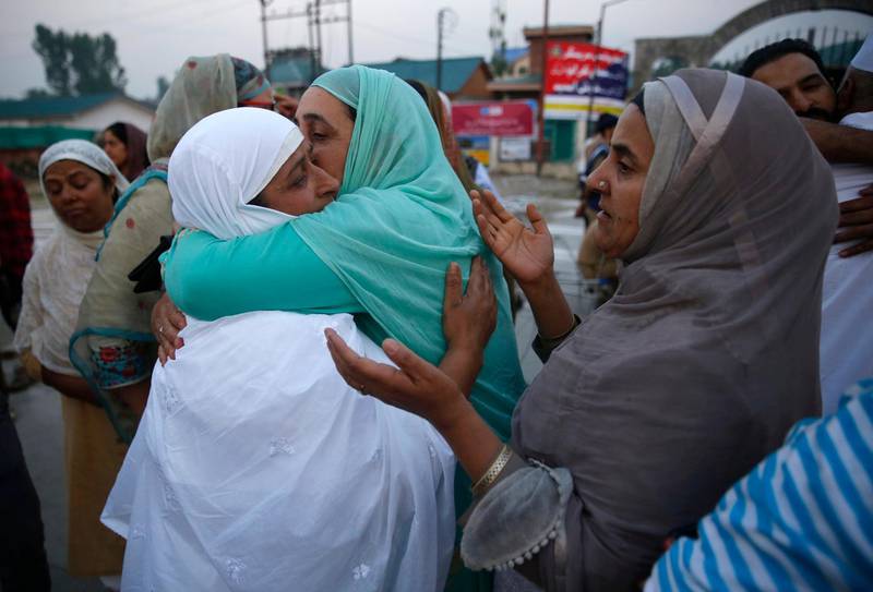 A Kashmiri Muslim pilgrim hugs her relative before leaving for the Hajj pilgrimage in Srinagar,  EPA