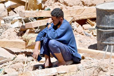 A man cries as he sits on the rubble of a house in the village of Tiksit, south of Adassil, two days after a devastating 6. 8-magnitude earthquake struck the country. Moroccans on September 10 mourned the victims of a devastating earthquake that killed more than 2,000 people as rescue teams raced to find survivors trapped under the rubble of flattened villages. AFP