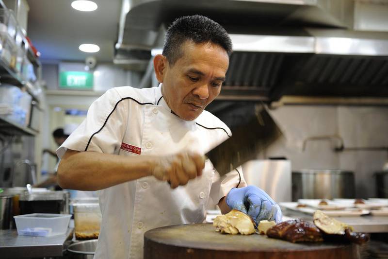 Hawker Chan Hon Meng's soya sauce chicken noodles or rice, which won a Michelin star in 2016, is touted as the world’s cheapest Michelin-starred meal. Munshi Ahmed for The National
