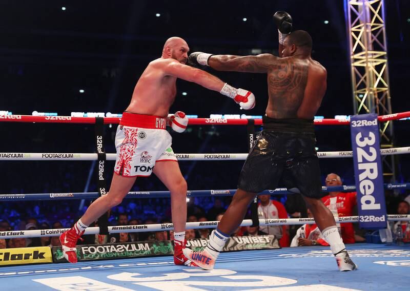 Tyson Fury and Dillian Whyte exchange punches during their WBC world heavyweight title fight. Getty